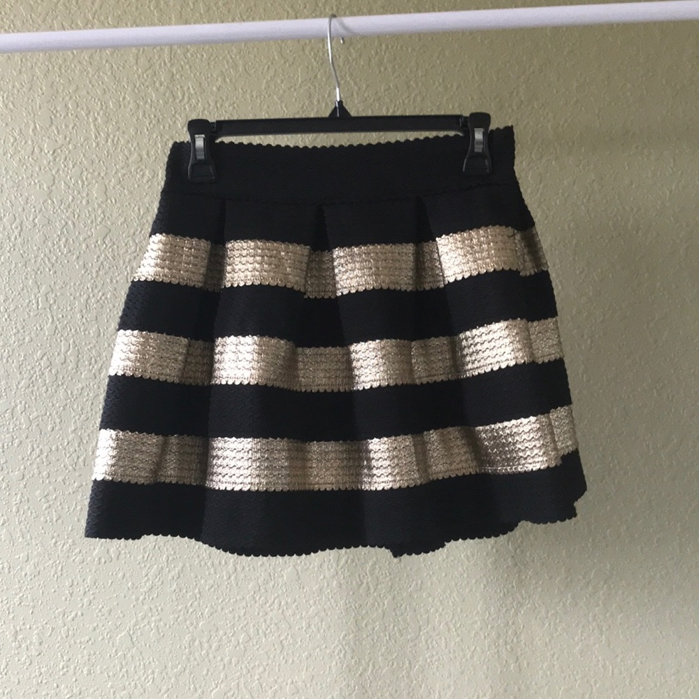 It’s a black and gold skirt only used twice